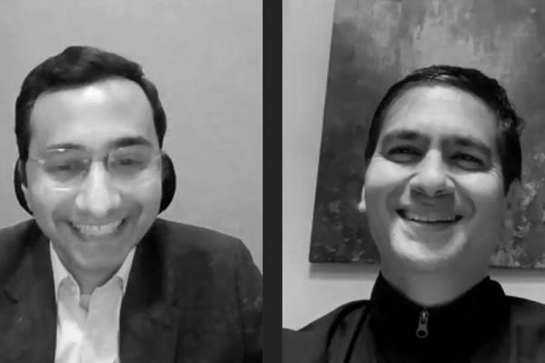Two men smiling